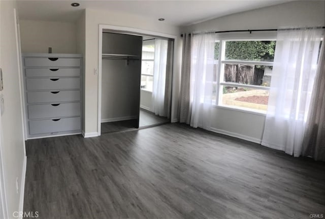 3512 Palm Ave, Manhattan Beach, CA 90266 - unfurnished bedroom featuring multiple windows, baseboards, dark wood-style flooring, and a closet