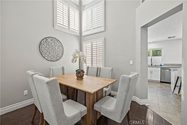 27834 Lassen St, Castaic, CA 91384 - dining room with light wood-style floors and a towering ceiling
