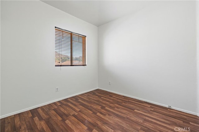 27834 Lassen St, Castaic, CA 91384 - spare room with dark wood-style floors and baseboards