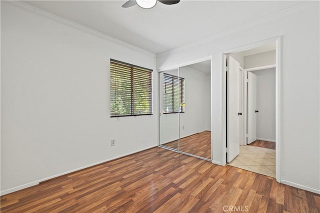 27834 Lassen St, Castaic, CA 91384 - unfurnished bedroom with wood finished floors, crown molding, a closet, and ceiling fan
