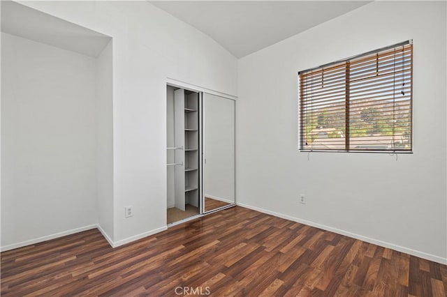 27834 Lassen St, Castaic, CA 91384 - unfurnished bedroom featuring wood finished floors, a closet, and lofted ceiling