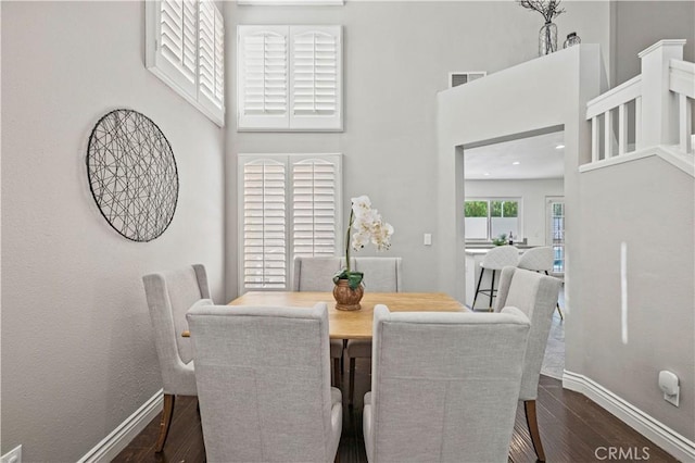 27834 Lassen St, Castaic, CA 91384 - dining area with dark wood-style flooring and a towering ceiling