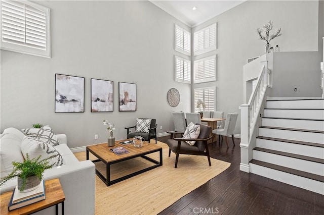 27834 Lassen St, Castaic, CA 91384 - living room featuring hardwood / wood-style flooring, stairs, and a towering ceiling