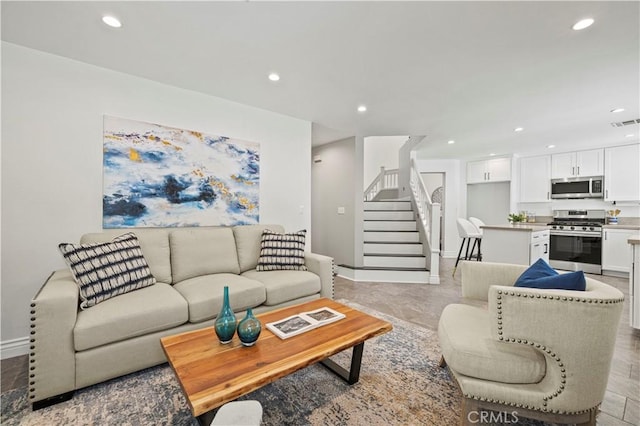 27834 Lassen St, Castaic, CA 91384 - living room featuring recessed lighting and stairway