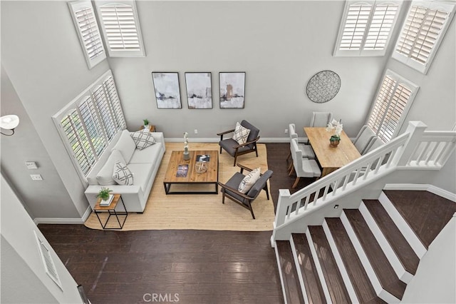 27834 Lassen St, Castaic, CA 91384 - living room featuring a towering ceiling and wood finished floors