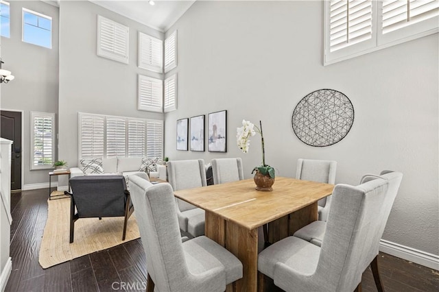 27834 Lassen St, Castaic, CA 91384 - dining space with a towering ceiling and dark wood-type flooring