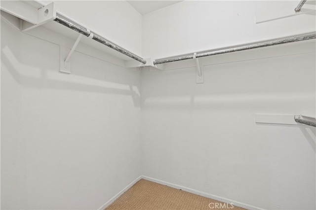 27834 Lassen St, Castaic, CA 91384 - walk in closet featuring light carpet