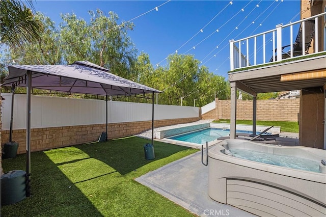 27834 Lassen St, Castaic, CA 91384 - view of swimming pool with an outdoor hot tub, a fenced backyard, and a gazebo