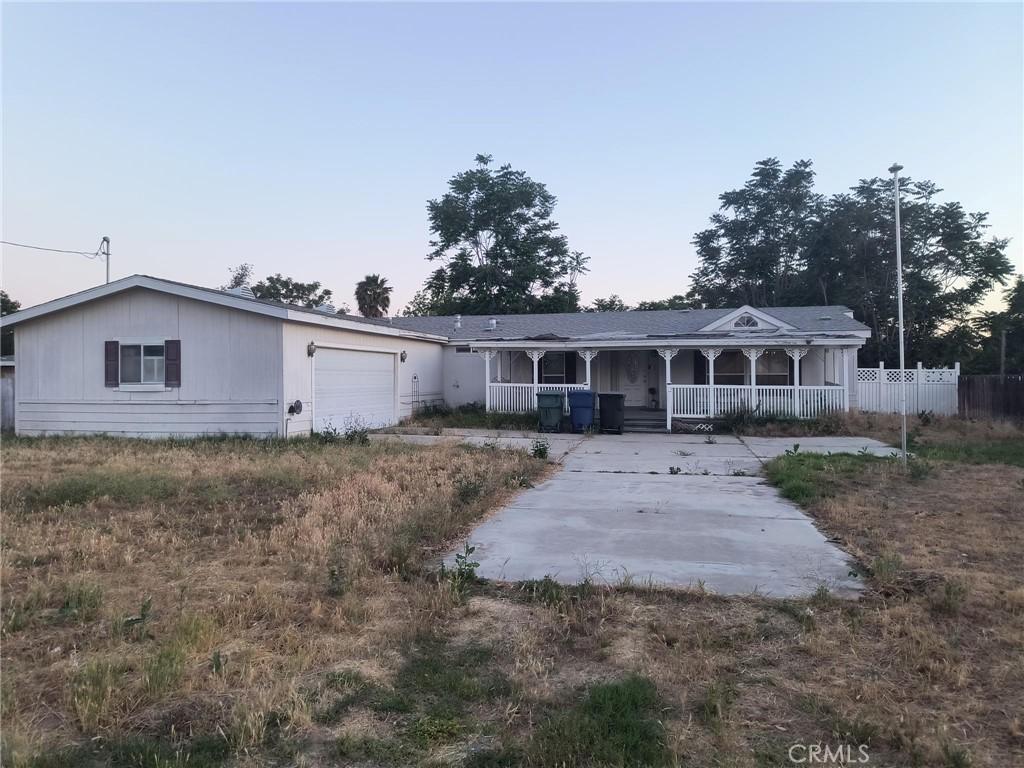 3858 Carter St, Riverside, CA 92501 - view of front of home with a porch and an attached garage