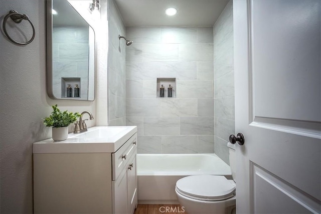 784 W 17th St, San Bernardino, CA 92405 - full bathroom featuring vanity, toilet, shower / tub combination, and recessed lighting