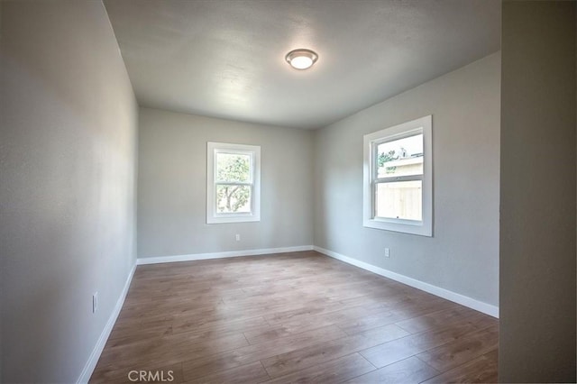 784 W 17th St, San Bernardino, CA 92405 - unfurnished room with baseboards and wood finished floors