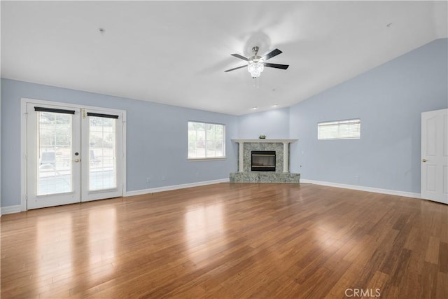 1641 Ford St, Redlands, CA 92373 - unfurnished living room featuring lofted ceiling, a ceiling fan, wood finished floors, baseboards, and a premium fireplace