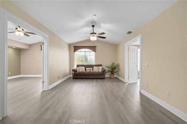 1641 Ford St, Redlands, CA 92373 - living area with a ceiling fan, wood finished floors, vaulted ceiling, and baseboards