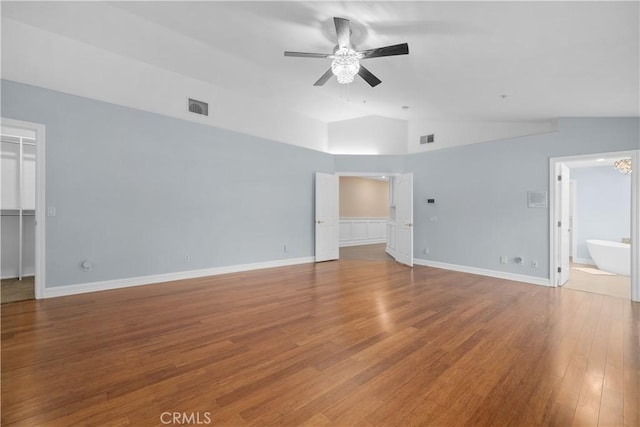 1641 Ford St, Redlands, CA 92373 - unfurnished bedroom with a walk in closet, vaulted ceiling, wood finished floors, a closet, and connected bathroom