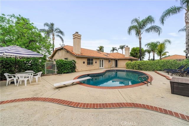 1641 Ford St, Redlands, CA 92373 - view of swimming pool with a patio area, a gate, and a diving board
