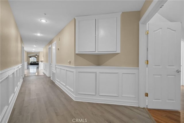 1641 Ford St, Redlands, CA 92373 - hall with a decorative wall, a wainscoted wall, wood finished floors, and recessed lighting