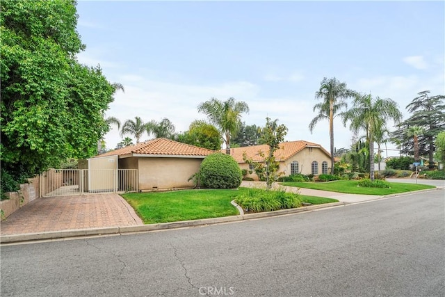 1641 Ford St, Redlands, CA 92373 - mediterranean / spanish-style house with a tiled roof, stucco siding, and a gate