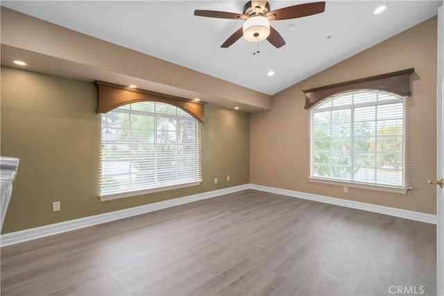 1641 Ford St, Redlands, CA 92373 - unfurnished room with wood finished floors, a ceiling fan, vaulted ceiling, baseboards, and recessed lighting