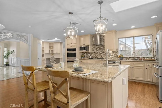 1641 Ford St, Redlands, CA 92373 - kitchen with a sink, appliances with stainless steel finishes, a center island with sink, tasteful backsplash, and recessed lighting