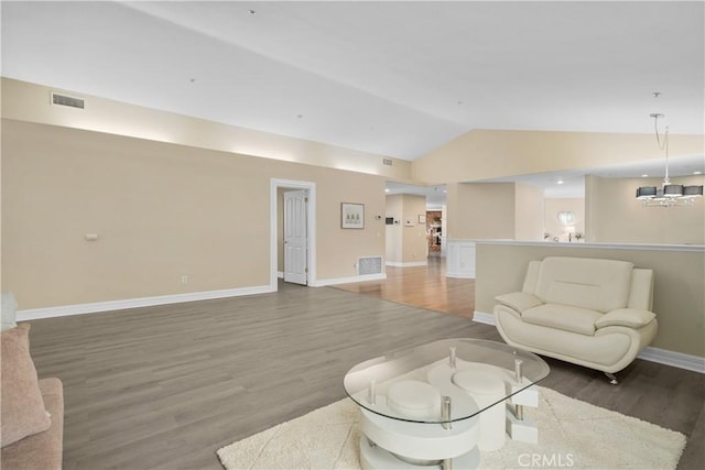 1641 Ford St, Redlands, CA 92373 - living room featuring lofted ceiling, light wood-type flooring, baseboards, and a chandelier