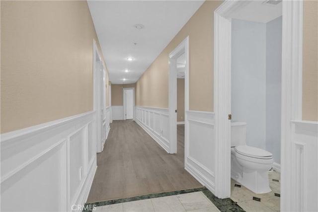 1641 Ford St, Redlands, CA 92373 - corridor with wainscoting and a decorative wall