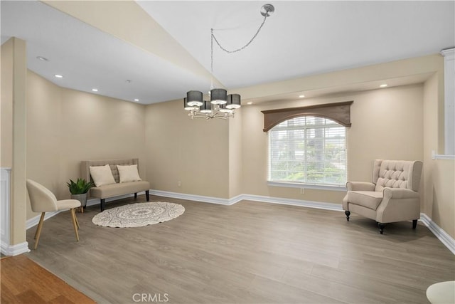 1641 Ford St, Redlands, CA 92373 - sitting room featuring wood finished floors, a chandelier, and baseboards