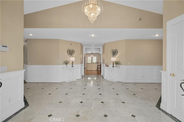 1641 Ford St, Redlands, CA 92373 - welcome area with a chandelier, high vaulted ceiling, a decorative wall, and wainscoting