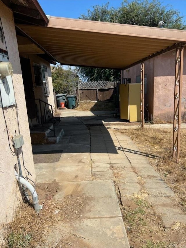 449 Citrus Ave, Imperial Beach, CA 91932 - view of parking / parking lot featuring an attached carport and driveway