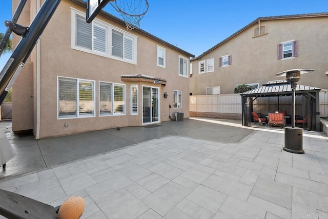 16231 Palomino Mesa Ct, San Diego, CA 92127 - back of house featuring a gazebo, stucco siding, a patio area, and central AC unit