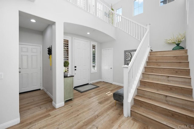 16231 Palomino Mesa Ct, San Diego, CA 92127 - foyer featuring light wood-style flooring, stairs, baseboards, recessed lighting, and a high ceiling