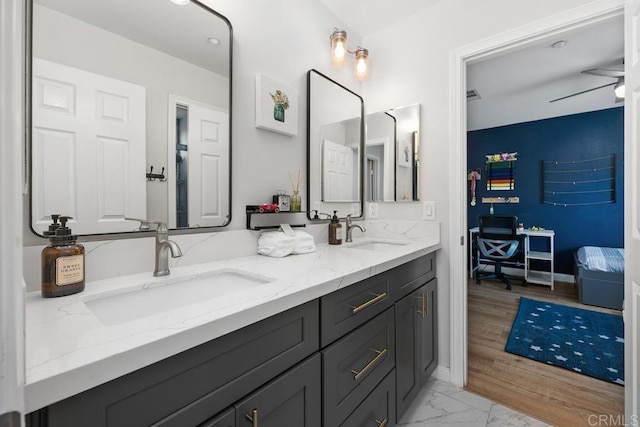 16231 Palomino Mesa Ct, San Diego, CA 92127 - bathroom with double vanity and marble look tiles