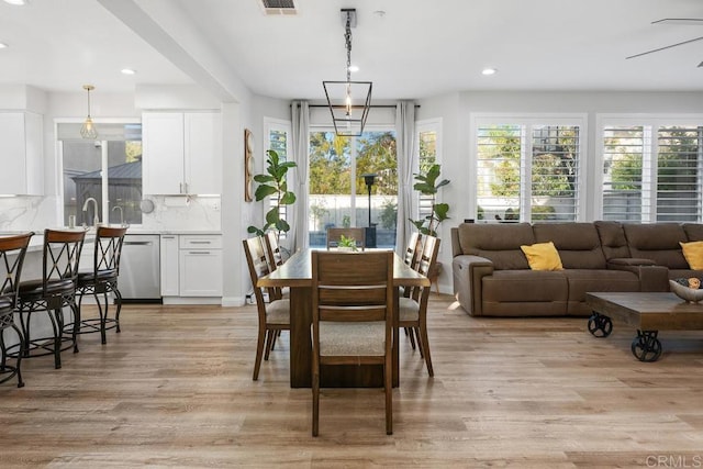 16231 Palomino Mesa Ct, San Diego, CA 92127 - dining area with light wood finished floors and recessed lighting