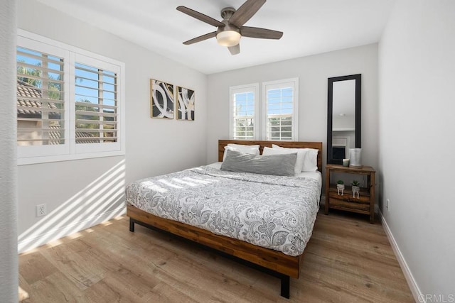 16231 Palomino Mesa Ct, San Diego, CA 92127 - bedroom with wood finished floors, baseboards, and a ceiling fan