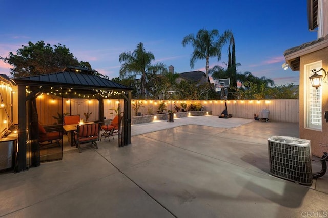 16231 Palomino Mesa Ct, San Diego, CA 92127 - patio terrace at dusk featuring a gazebo, a patio, and a fenced backyard