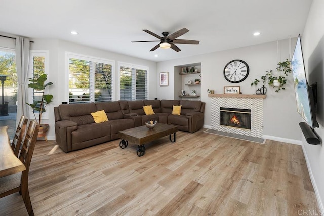 16231 Palomino Mesa Ct, San Diego, CA 92127 - living room featuring light wood finished floors, plenty of natural light, a tile fireplace, ceiling fan, and recessed lighting
