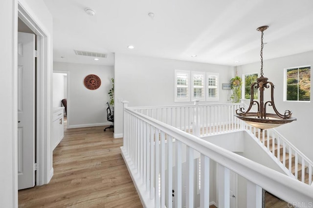 16231 Palomino Mesa Ct, San Diego, CA 92127 - hall featuring an upstairs landing, light wood-style flooring, recessed lighting, and a chandelier