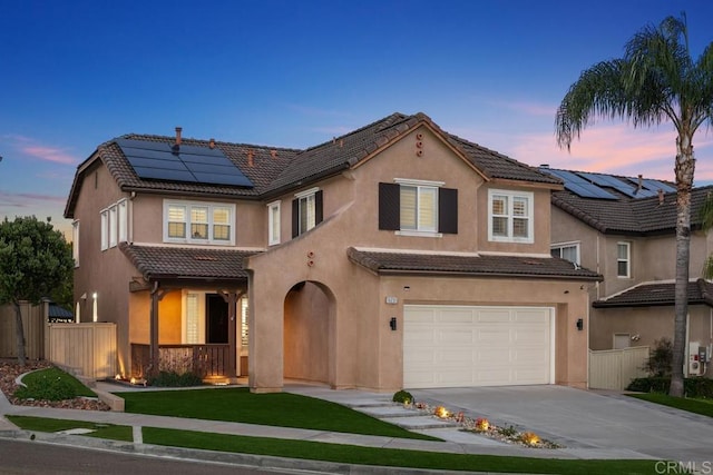 16231 Palomino Mesa Ct, San Diego, CA 92127 - view of front of house with a tile roof, an attached garage, solar panels, stucco siding, and driveway