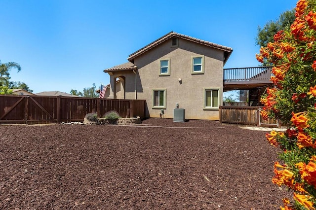 2292 Marquand Ct, Alpine, CA 91901 - rear view of house featuring central AC, a fenced backyard, and stucco siding