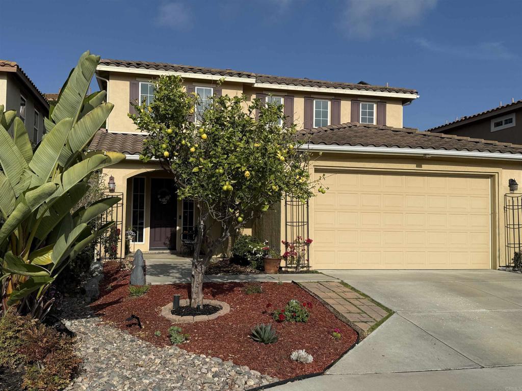 1176 Parkview Dr, Oceanside, CA 92057 - view of front of property with concrete driveway, a tile roof, stucco siding, and a garage