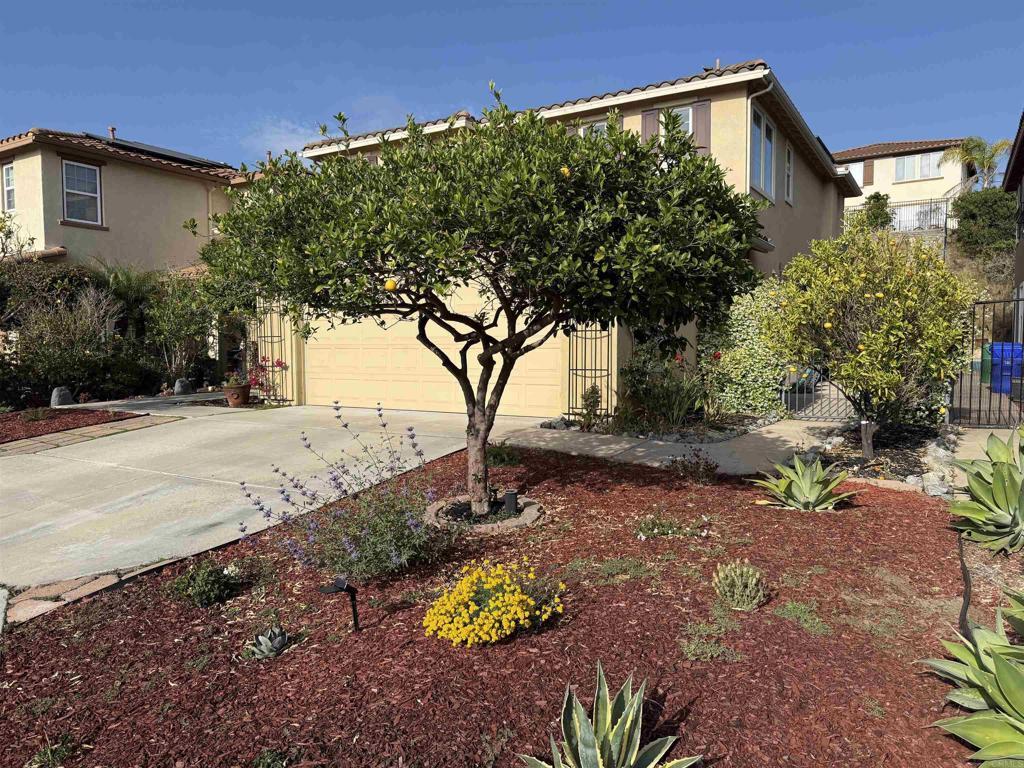1176 Parkview Dr, Oceanside, CA 92057 - obstructed view of property featuring concrete driveway, stucco siding, and an attached garage