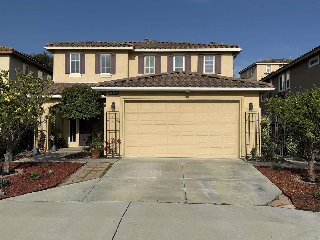1176 Parkview Dr, Oceanside, CA 92057 - view of front of home featuring concrete driveway, stucco siding, a tiled roof, and an attached garage