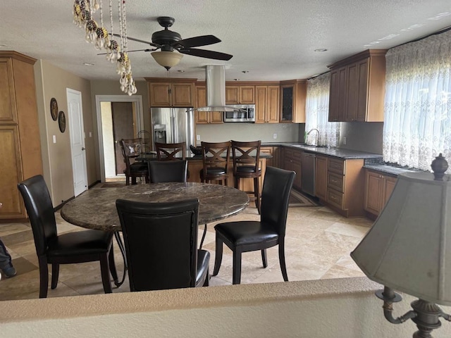 6591 Black Rail Rd, Carlsbad, CA 92011 - dining space with ceiling fan and a textured ceiling