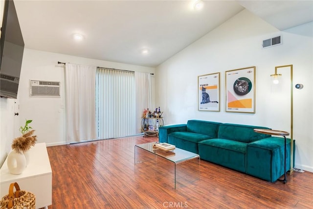 23292 Orange Ave Unit 6, Lake Forest, CA 92630 - living room featuring vaulted ceiling, wood finished floors, recessed lighting, an AC wall unit, and baseboards