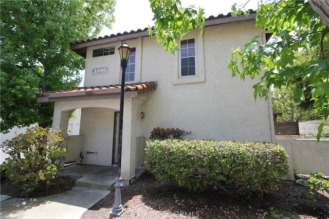 23362 La Mar Unit A, Mission Viejo, CA 92691 - view of front of home featuring stucco siding and a tile roof