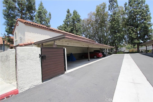 23362 La Mar Unit A, Mission Viejo, CA 92691 - garage featuring covered parking and a gate
