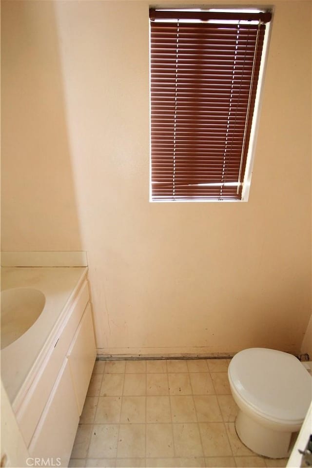 23362 La Mar Unit A, Mission Viejo, CA 92691 - half bath featuring vanity, toilet, tile patterned floors, and baseboards