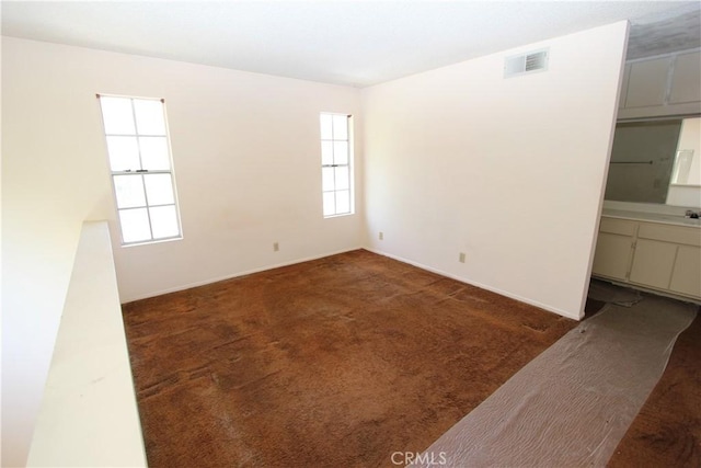 23362 La Mar Unit A, Mission Viejo, CA 92691 - spare room featuring plenty of natural light, carpet, and baseboards