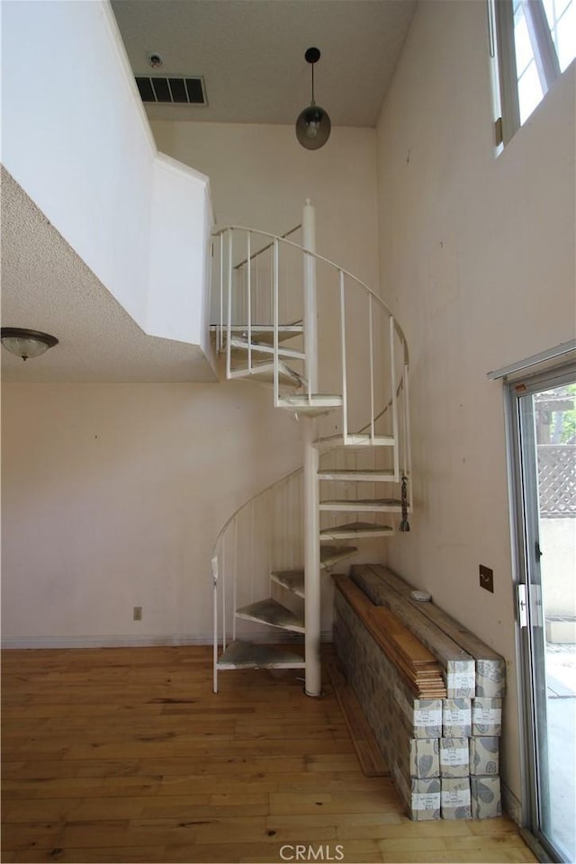 23362 La Mar Unit A, Mission Viejo, CA 92691 - stairway with wood finished floors and a towering ceiling