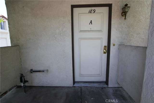 23362 La Mar Unit A, Mission Viejo, CA 92691 - doorway to property featuring stucco siding