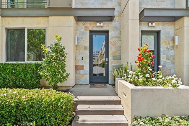 27 Delancy, Irvine, CA 92612 - entrance to property with stone siding